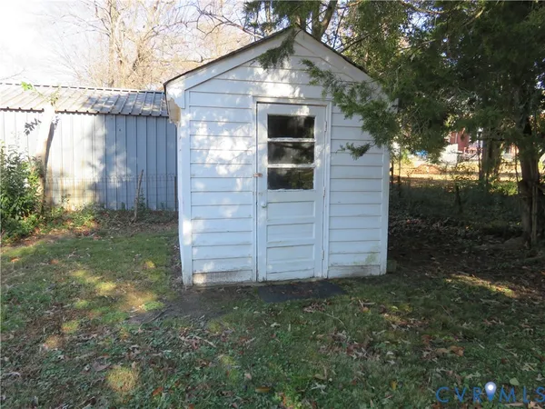 a view of a backyard of the house