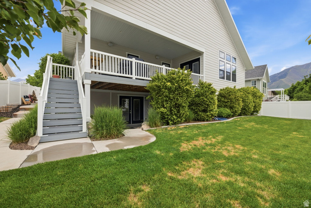 2109 Sunflower Lane Mapleton, UT 84664 - Photo 41 of 43 Backyard w/ Covered Deck and Basement Entrance & Professional Landscaping