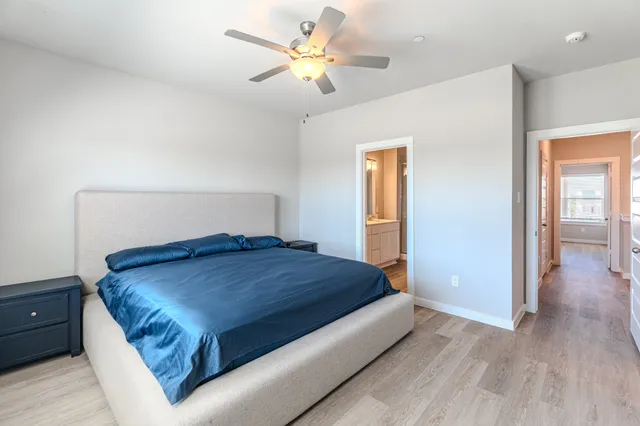 a bedroom with a bed and window