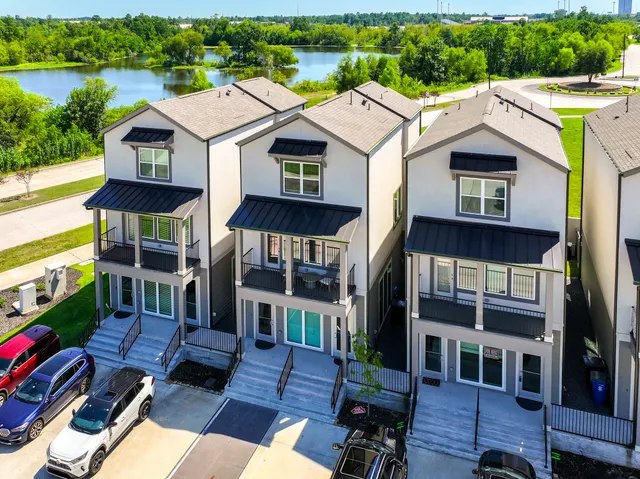 a aerial view of a house with a yard and furniture
