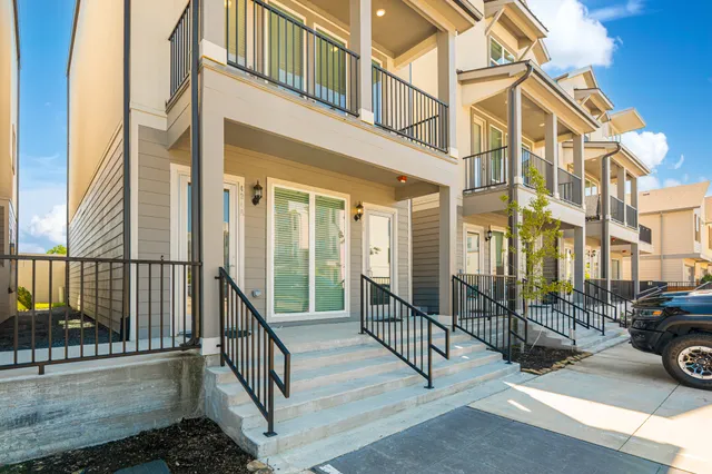 a view of a building with car parked
