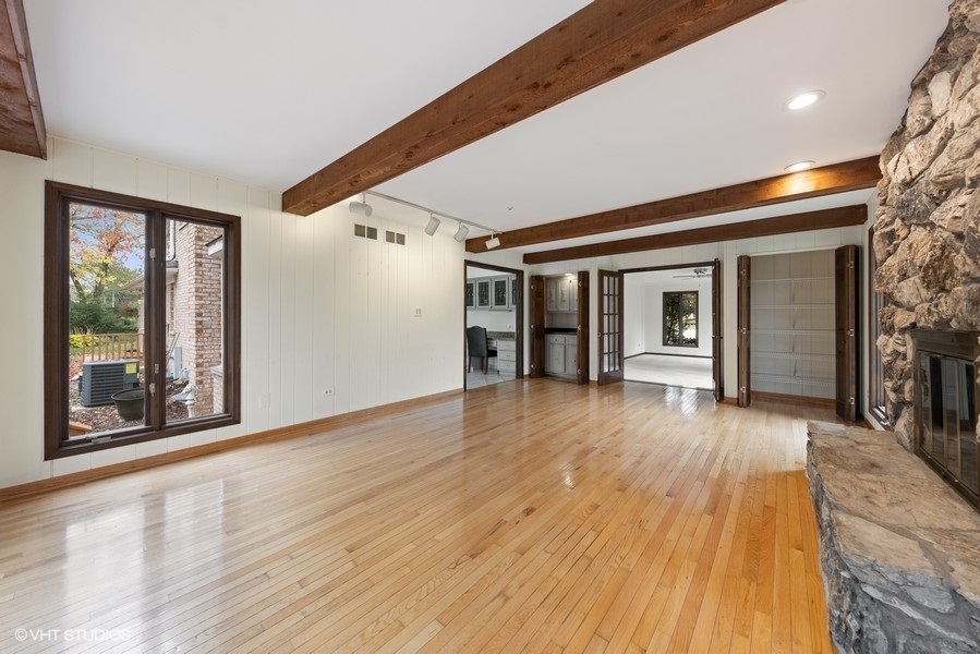 6318 Martin Drive Willowbrook, IL 60527 - Photo 11 of 33 a view of a hardwood floor and staircase in a room
