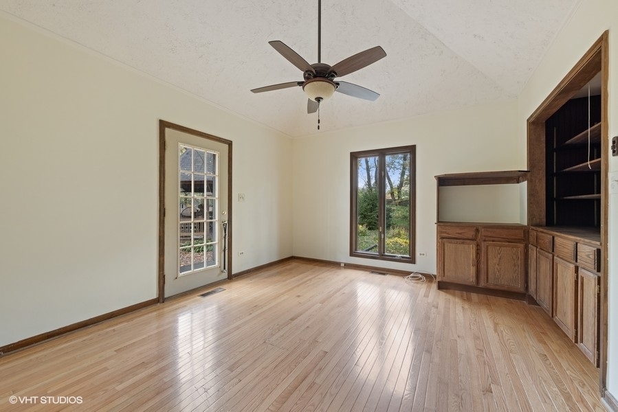 6318 Martin Drive Willowbrook, IL 60527 - Photo 12 of 33 wooden floor in an empty room with a window