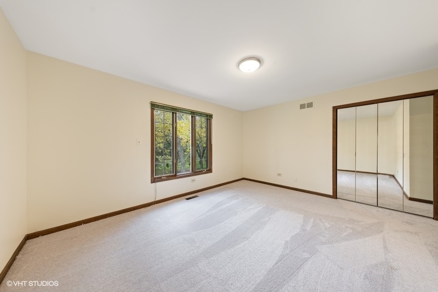 6318 Martin Drive Willowbrook, IL 60527 - Photo 22 of 33 an empty room with windows