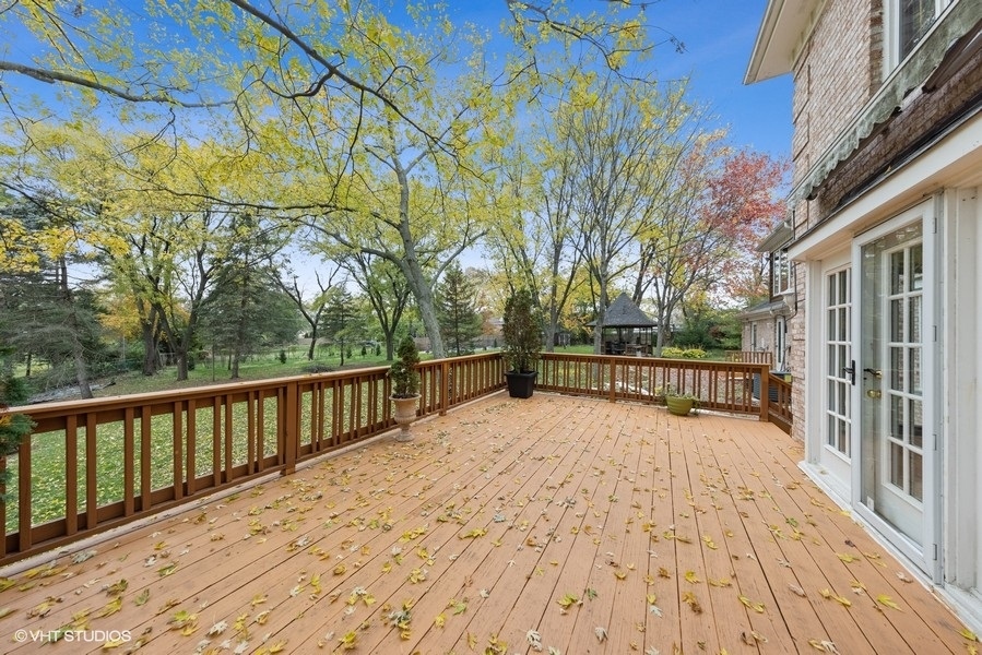 6318 Martin Drive Willowbrook, IL 60527 - Photo 24 of 33 a view of balcony with wooden floor and fence
