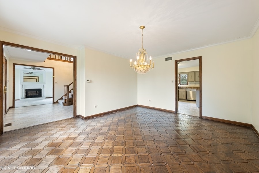 6318 Martin Drive Willowbrook, IL 60527 - Photo 31 of 33 a view of a room with a chandelier