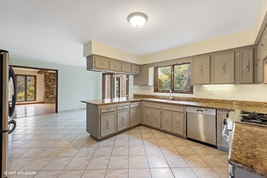 6318 Martin Drive Willowbrook, IL 60527 - Photo 32 of 33 a kitchen with a sink and cabinets