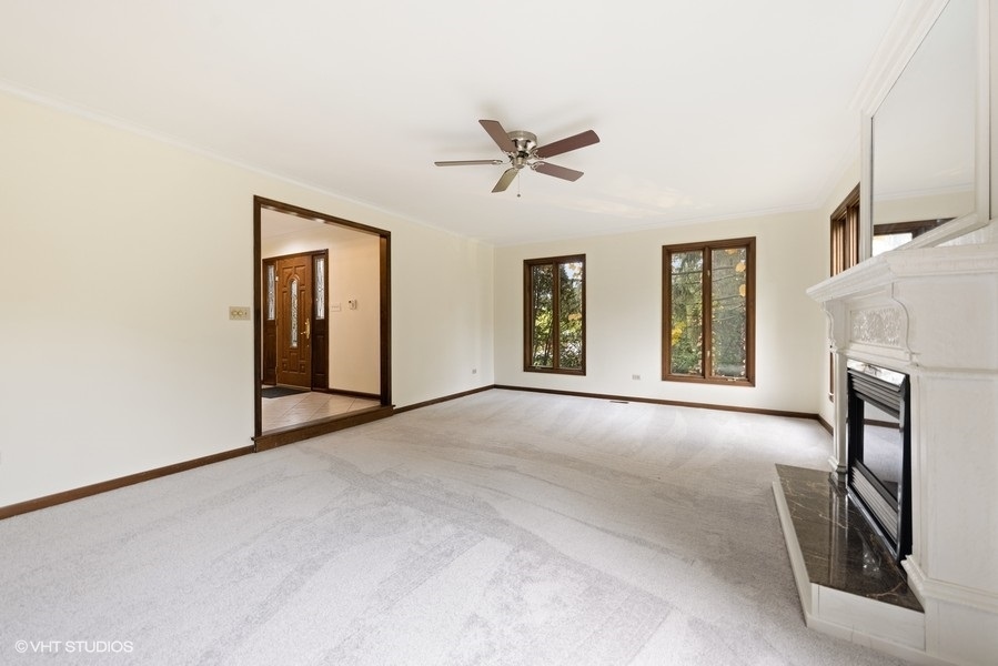 6318 Martin Drive Willowbrook, IL 60527 - Photo 6 of 33 a view of an empty room with a window and fireplace