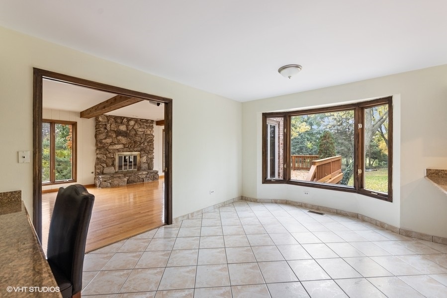 6318 Martin Drive Willowbrook, IL 60527 - Photo 8 of 33 a view of a livingroom with furniture wooden floor and a window