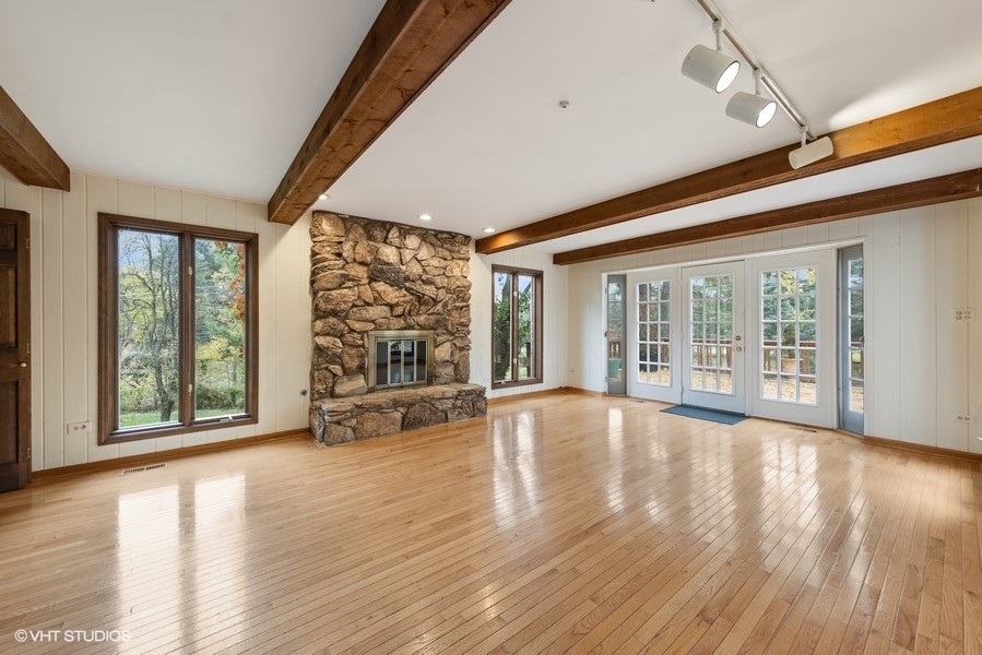 6318 Martin Drive Willowbrook, IL 60527 - Photo 10 of 33 a view of an empty room with wooden floor and a window