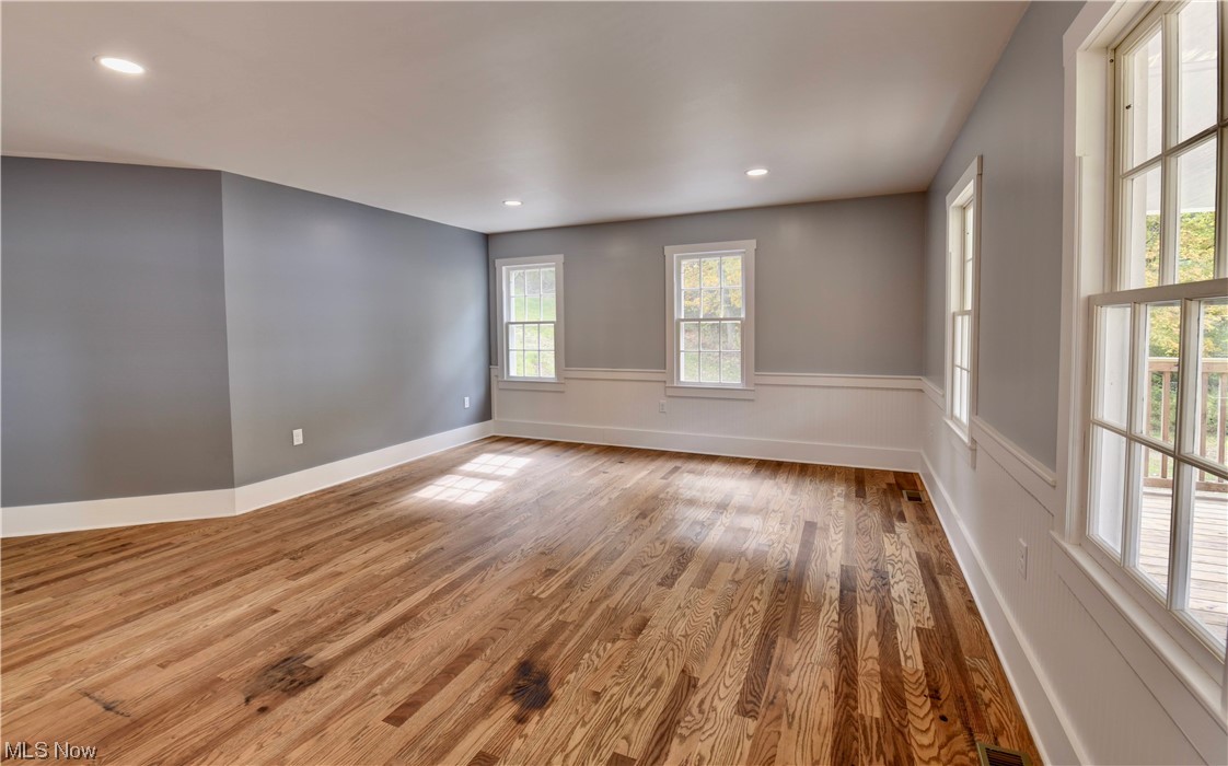 9734 Edwards Ridge Road Southeast Uhrichsville, OH 44683 - Photo 10 of 35 View of wood floored empty room