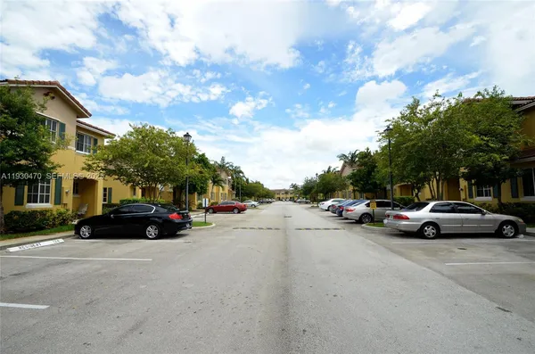 a view of street with parked cars