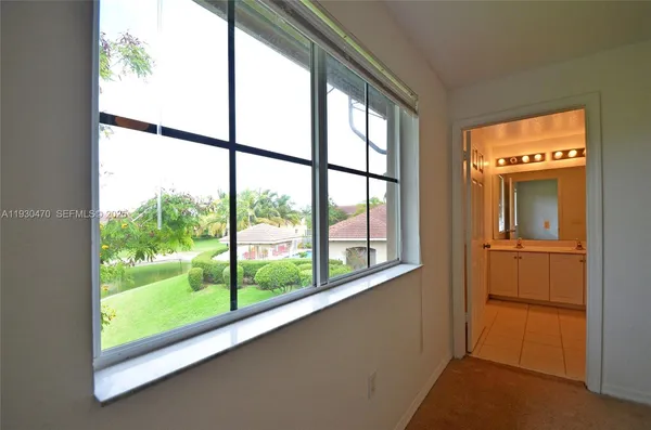 a view of a glass door and a balcony