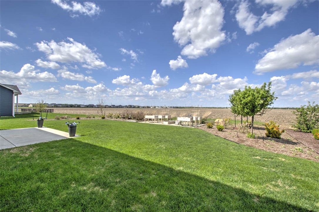 908 Declaration Drive Savoy, IL 61874 - Photo 11 of 41 a view of a golf course with a lake