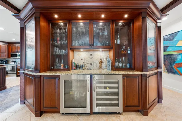 a view of a kitchen with furniture and staircase