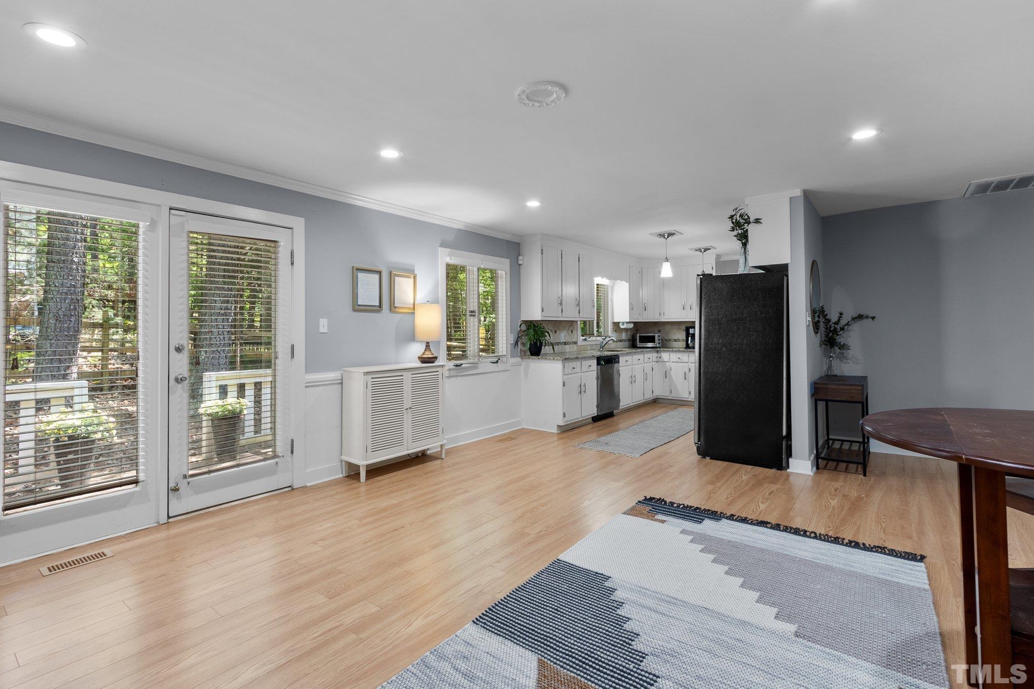 5 St James Court Durham, NC 27713 - Photo 18 of 44 a view of a kitchen with refrigerator and wooden floor