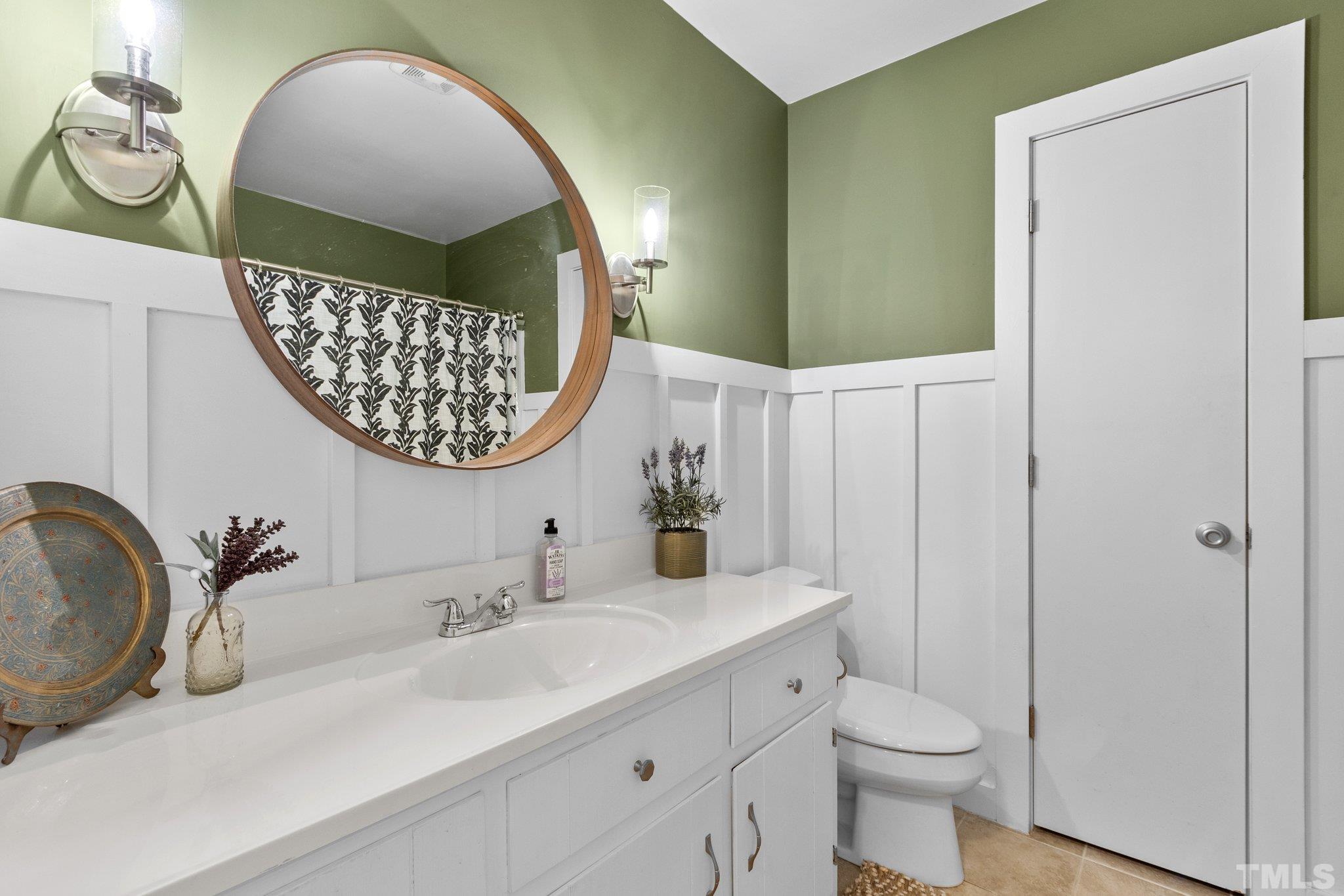 5 St James Court Durham, NC 27713 - Photo 19 of 44 a bathroom with a sink and a mirror