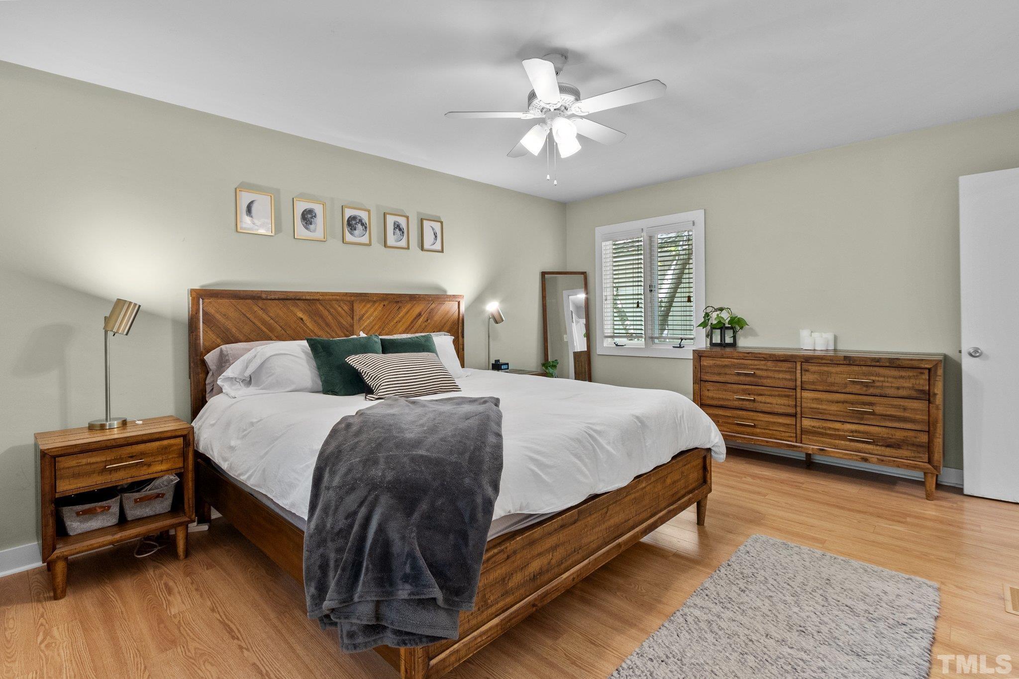 5 St James Court Durham, NC 27713 - Photo 22 of 44 a bedroom with a bed and a chandelier