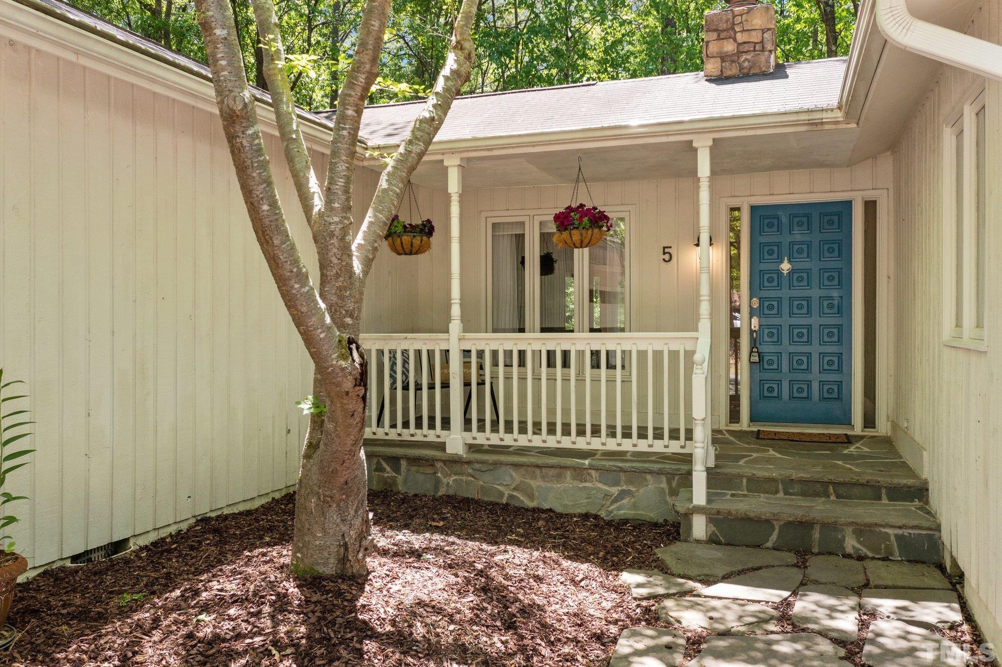 5 St James Court Durham, NC 27713 - Photo 4 of 44 a view of a house with a small yard and wooden fence