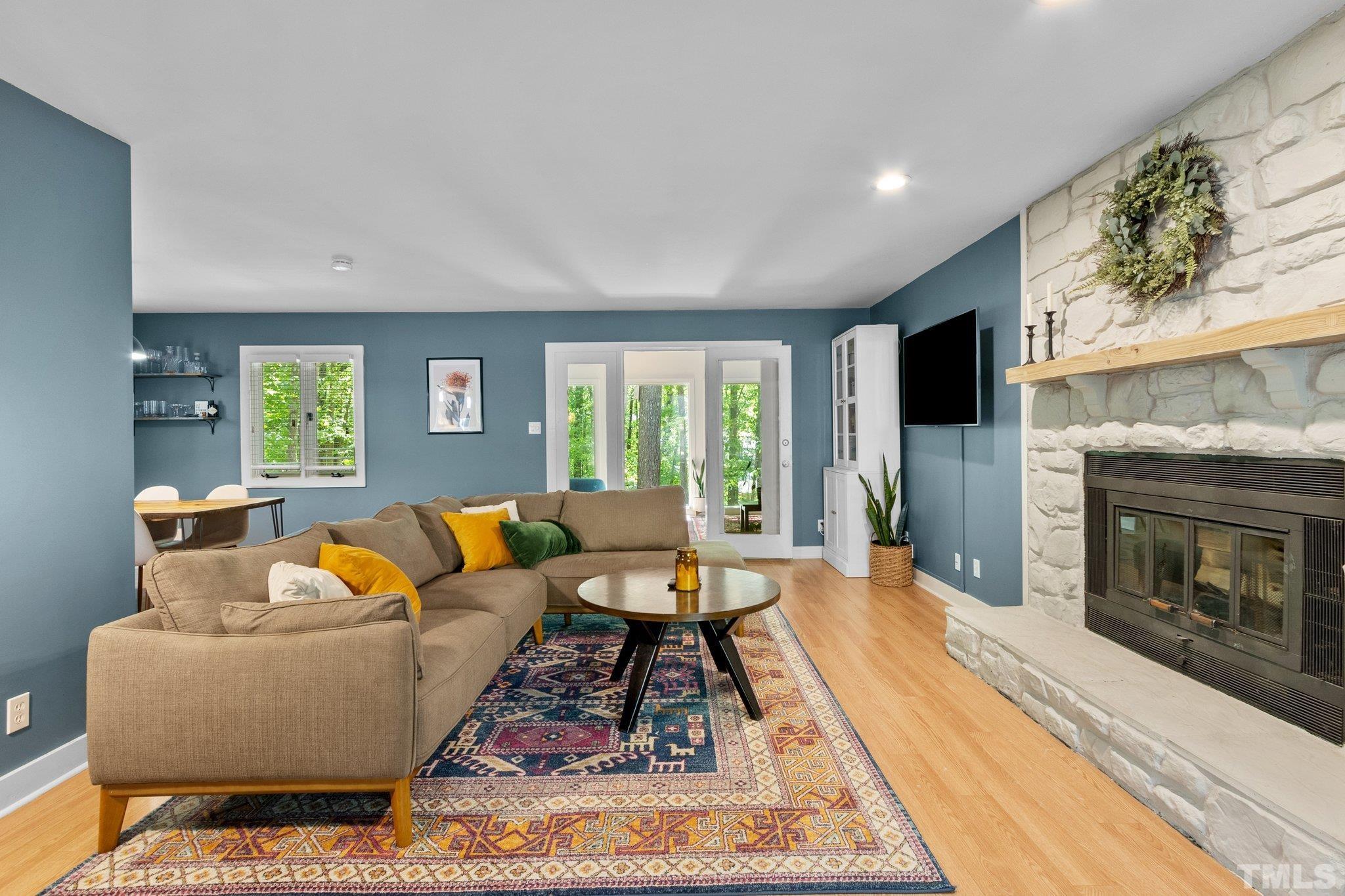 5 St James Court Durham, NC 27713 - Photo 7 of 44 a living room with furniture and a fireplace