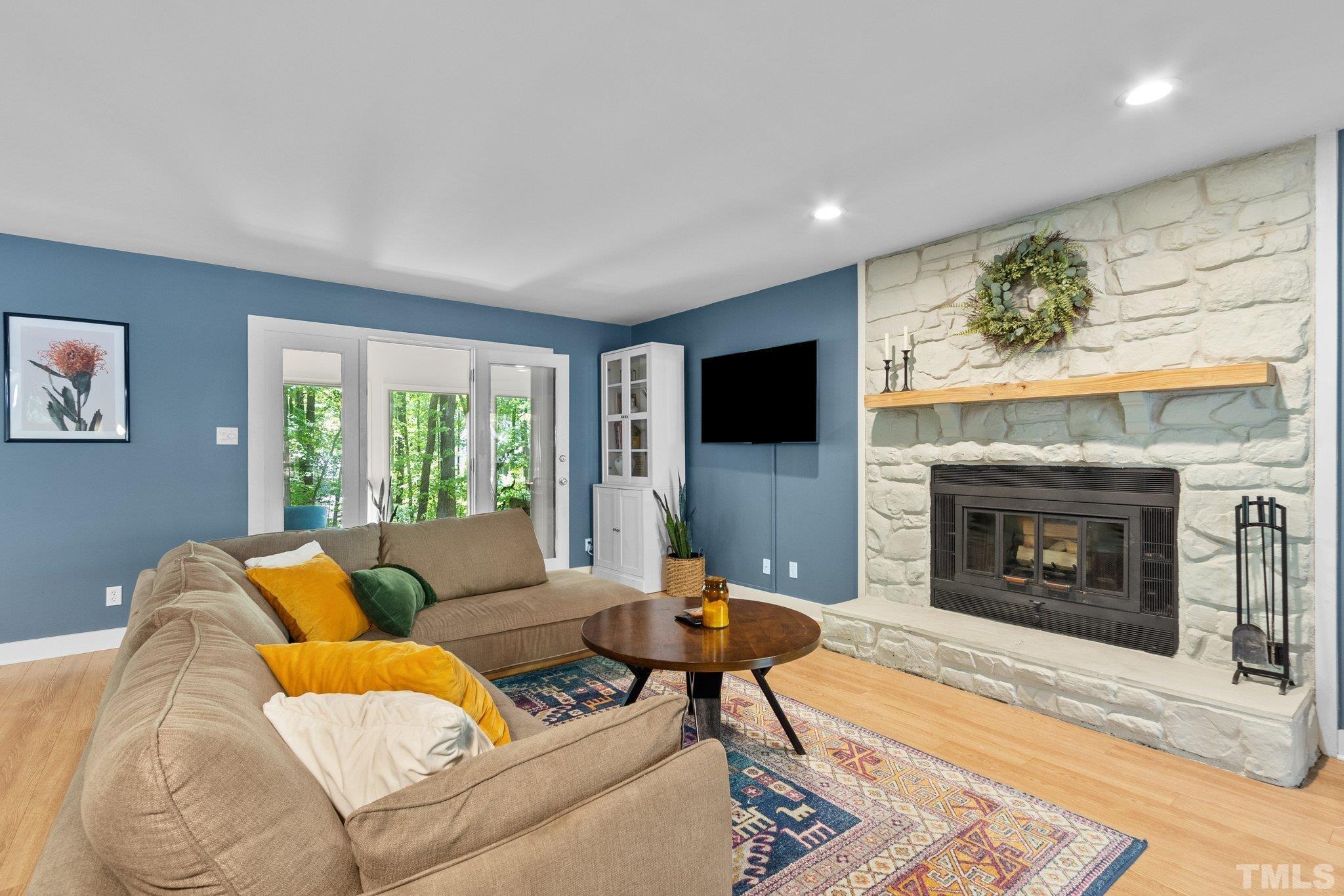 5 St James Court Durham, NC 27713 - Photo 8 of 44 a living room with furniture and a fireplace