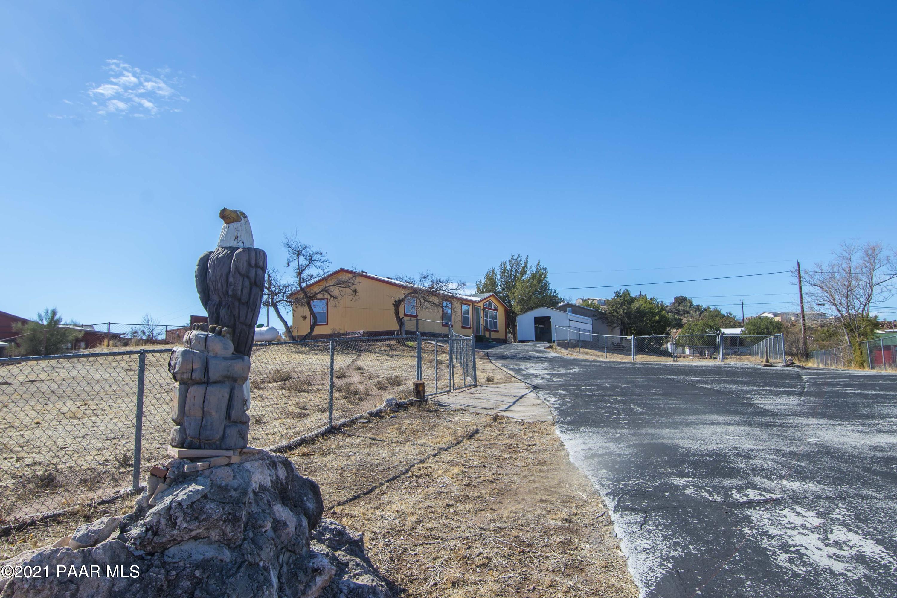 4650 Quail Hollow Road Rimrock, AZ 86335 - Photo 1 of 36 a front view of a house with a yard