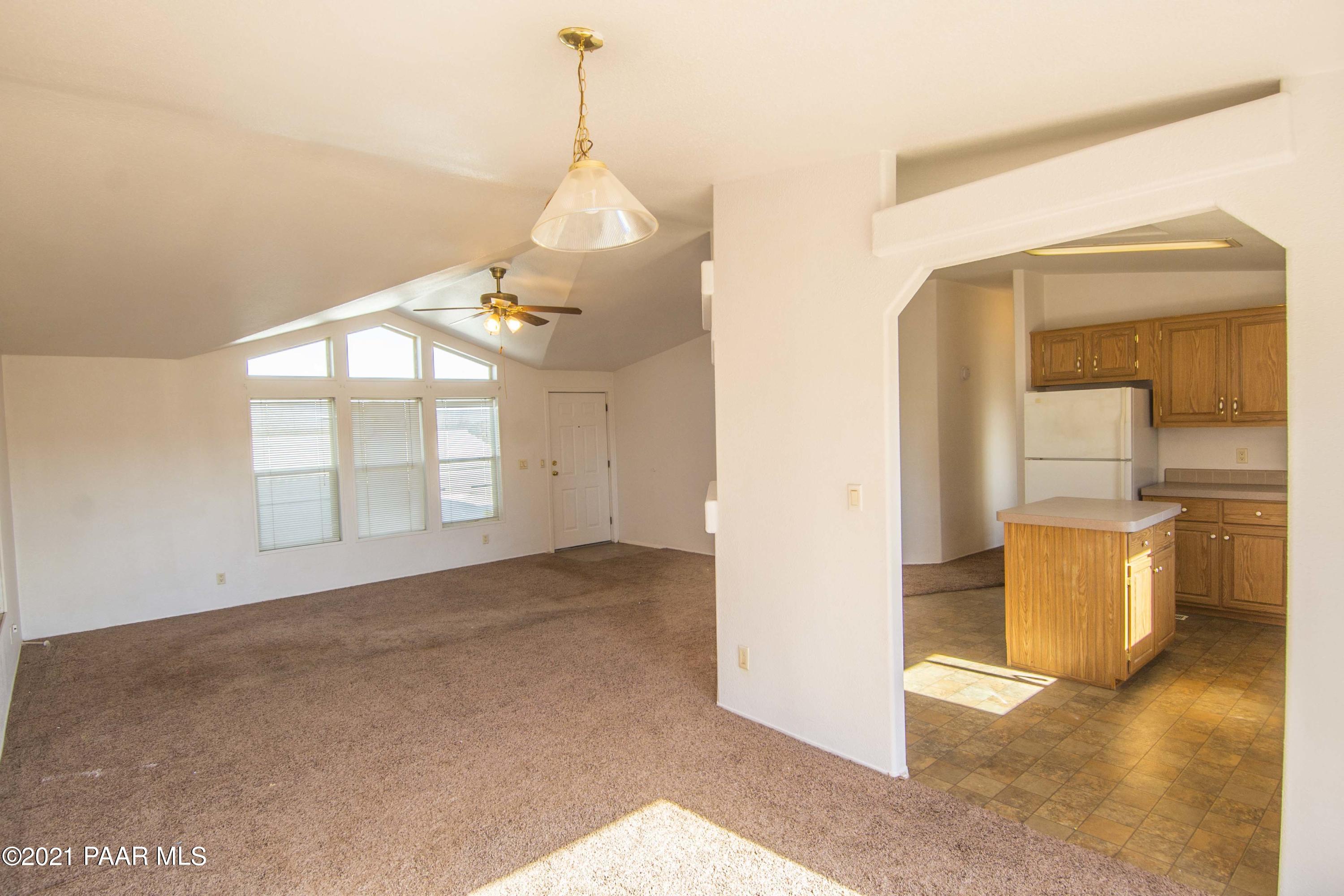 4650 Quail Hollow Road Rimrock, AZ 86335 - Photo 11 of 36 a view of empty room with wooden floor and fan
