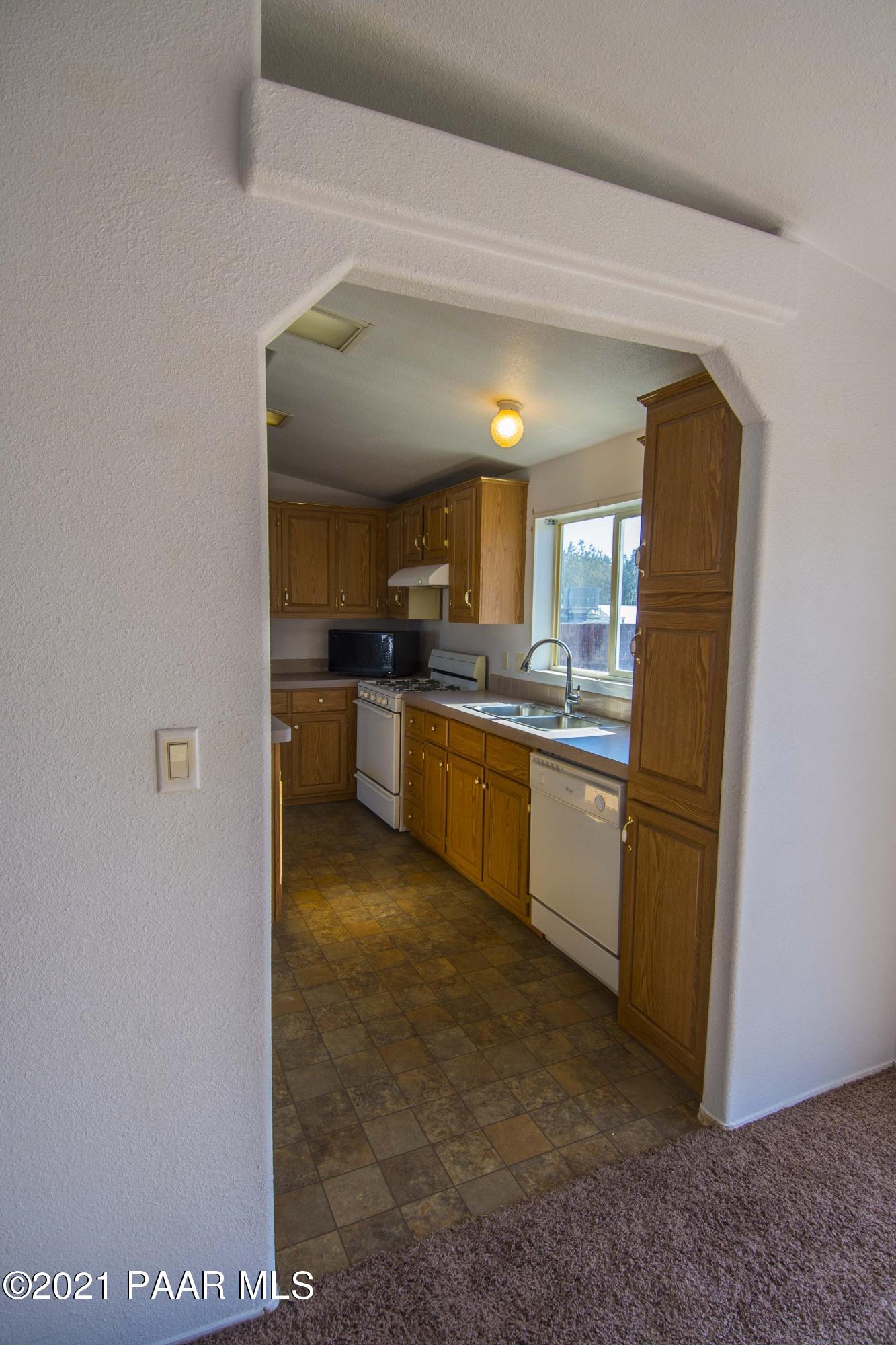 4650 Quail Hollow Road Rimrock, AZ 86335 - Photo 12 of 36 a kitchen with a sink a counter top space and appliances