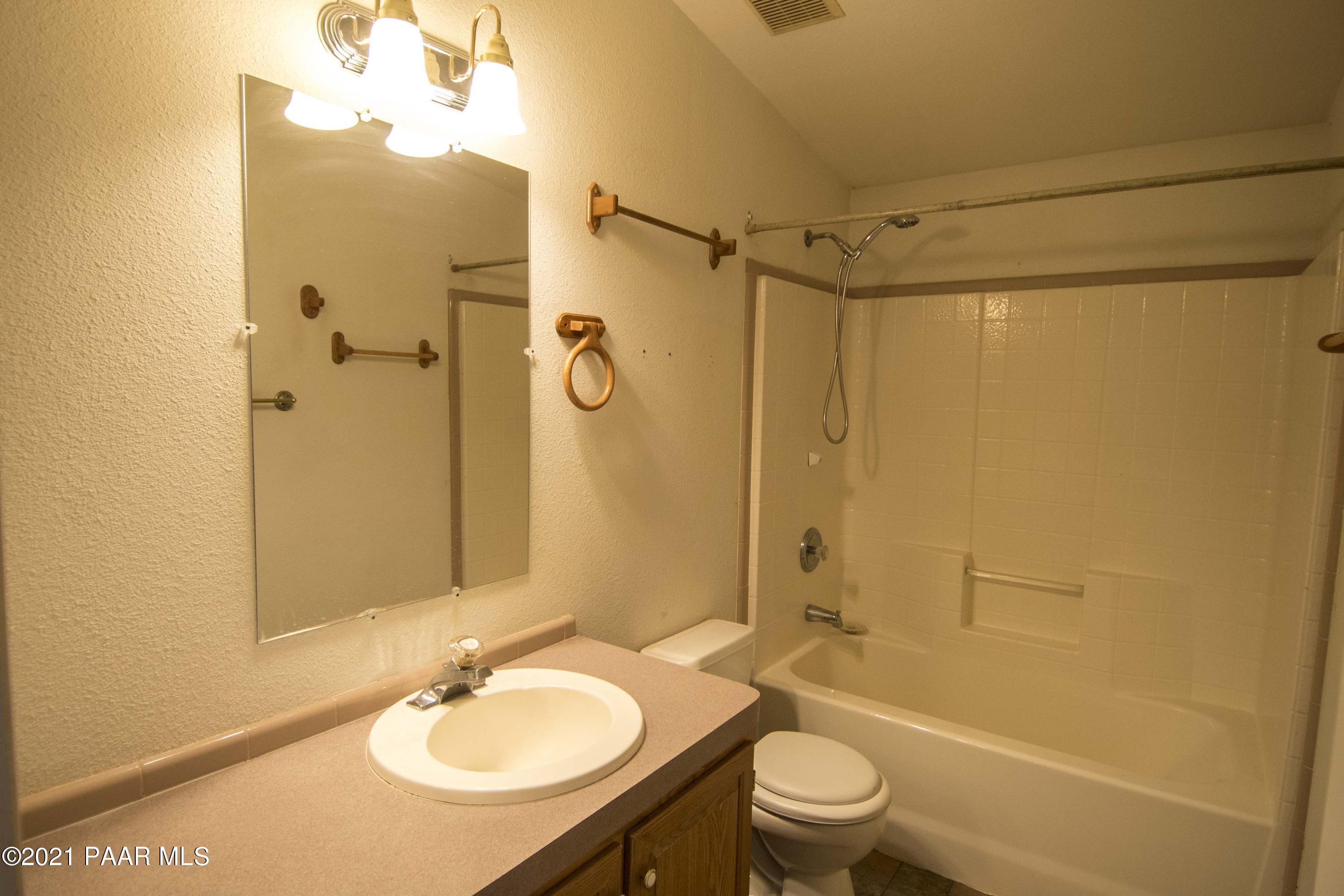 4650 Quail Hollow Road Rimrock, AZ 86335 - Photo 18 of 36 a bathroom with a sink toilet tub and shower