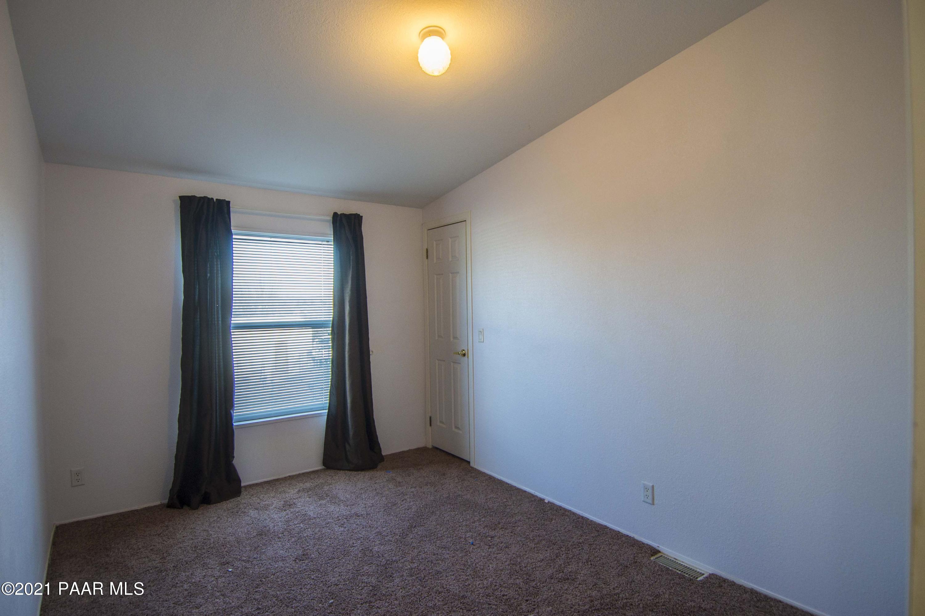 4650 Quail Hollow Road Rimrock, AZ 86335 - Photo 20 of 36 an empty room with entrance door