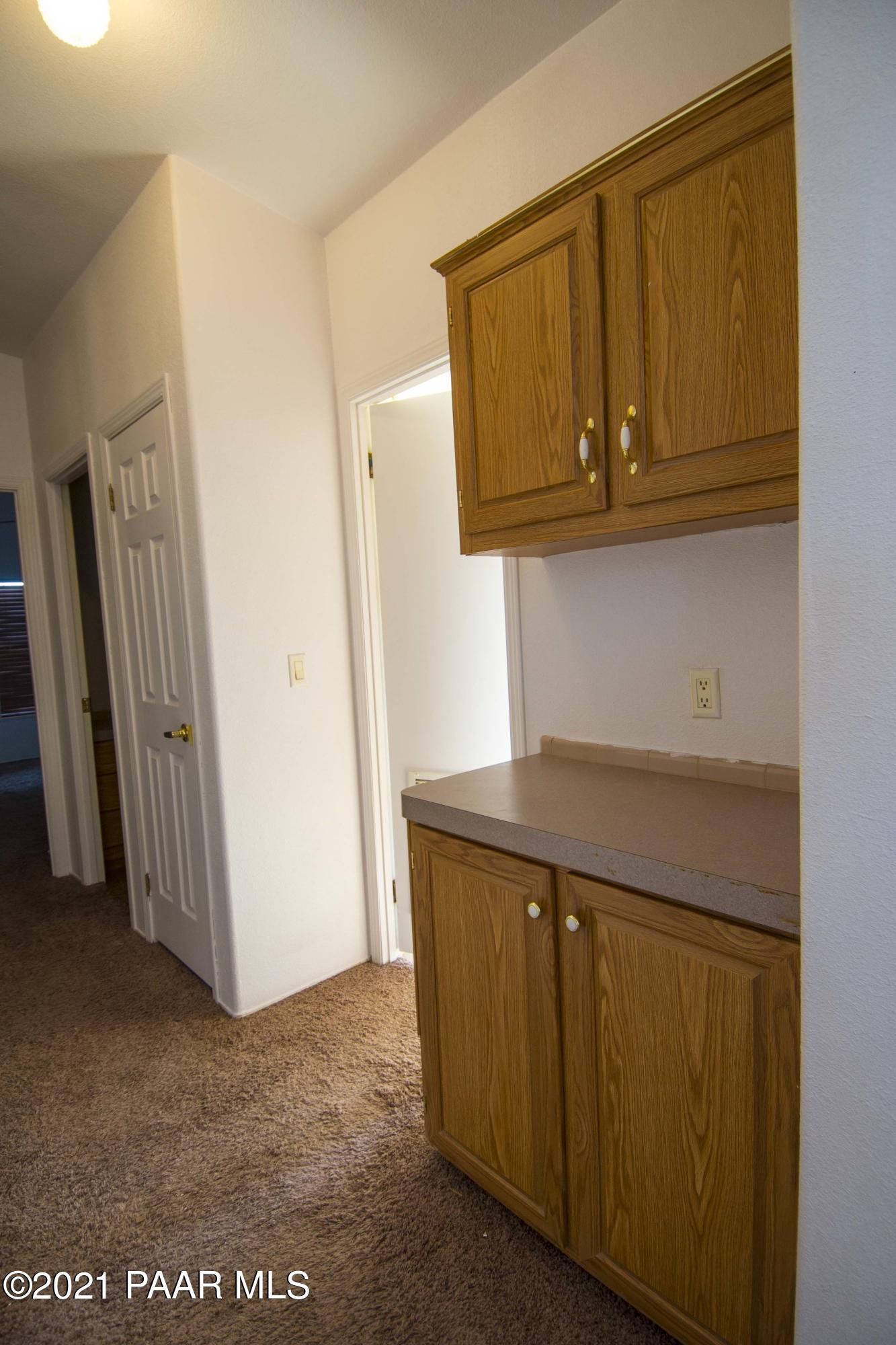 4650 Quail Hollow Road Rimrock, AZ 86335 - Photo 21 of 36 a kitchen with stainless steel appliances granite countertop a refrigerator and cabinets