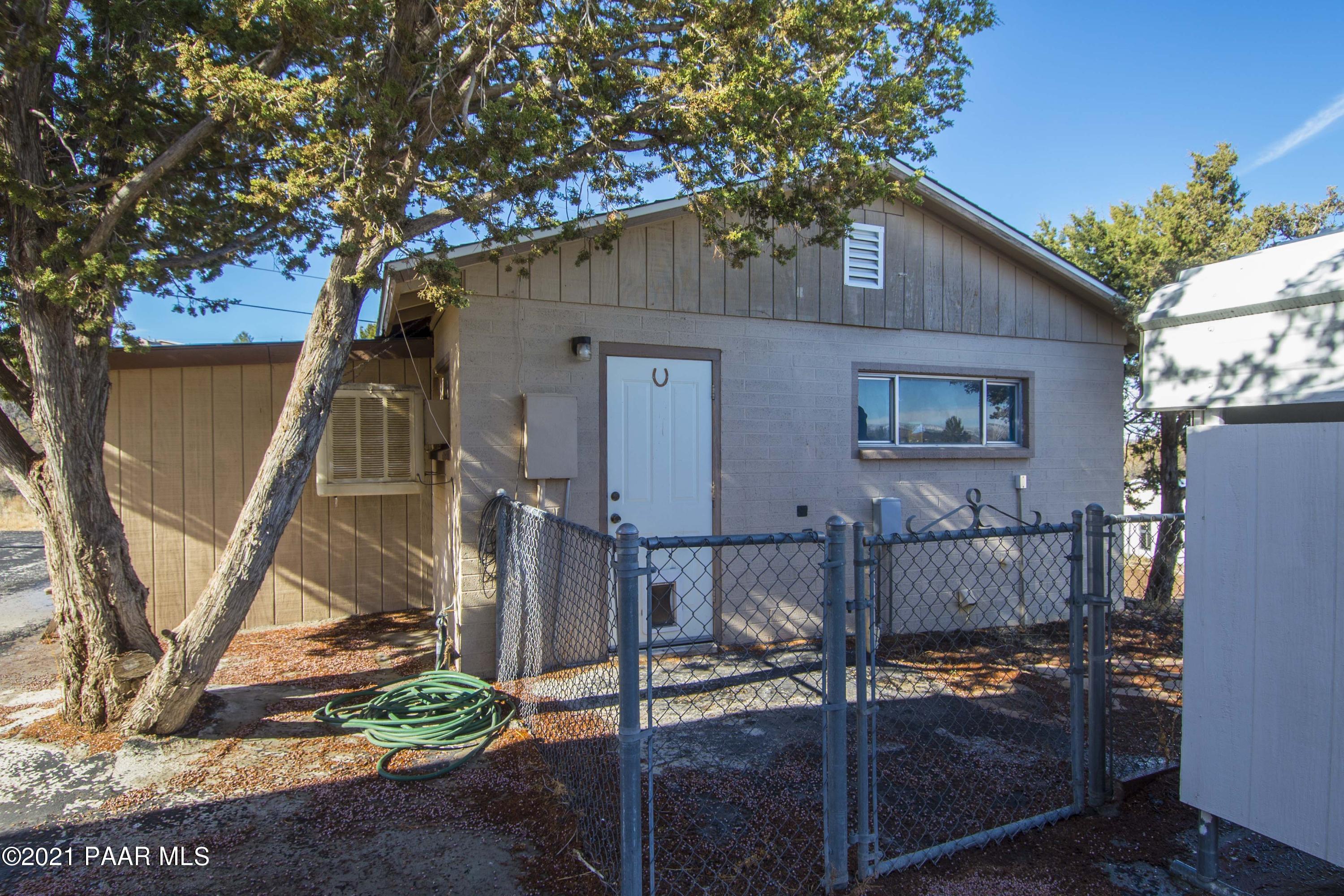 4650 Quail Hollow Road Rimrock, AZ 86335 - Photo 23 of 36 a backyard of a house with table and chairs