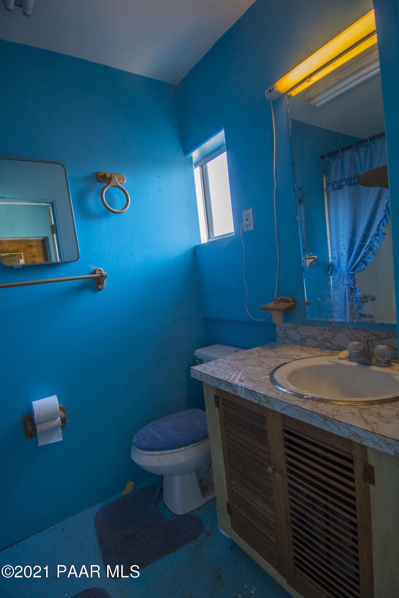 4650 Quail Hollow Road Rimrock, AZ 86335 - Photo 26 of 36 a bathroom with a sink and a toilet