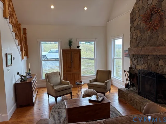 a dining room with furniture windows and a chandelier
