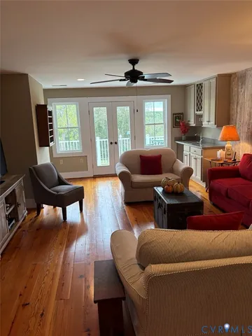 a bathroom with a granite countertop sink a toilet and mirror