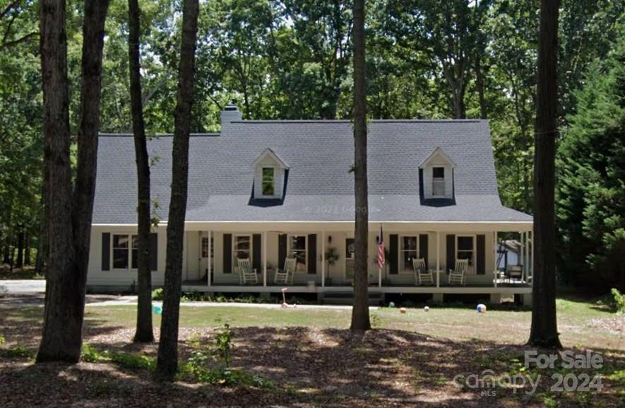 2235 Turnridge Court Fort Mill, SC 29708 - Photo 1 of 1 a view of a white house with large windows and a small yard