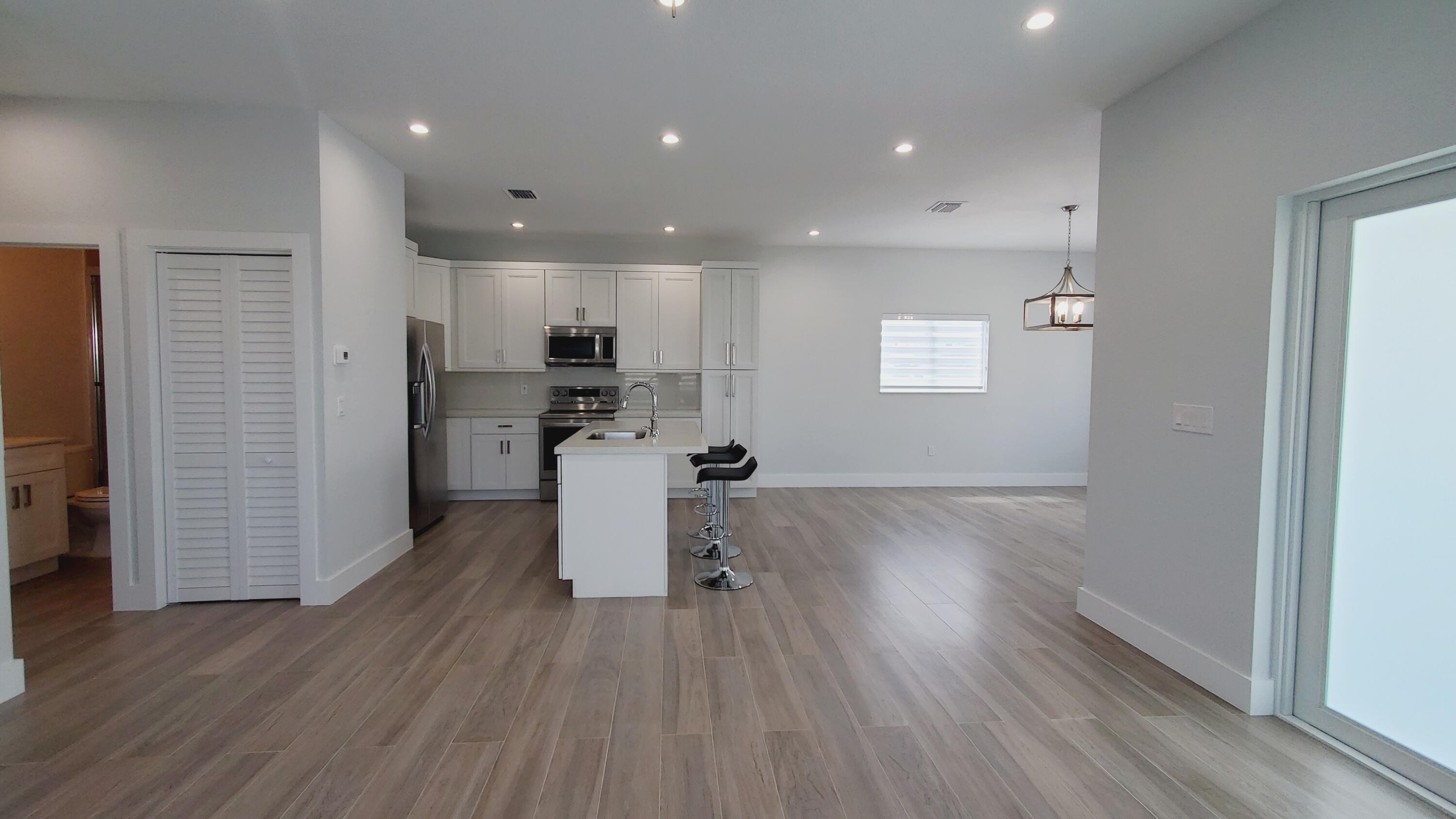 554 Gordon Circle Key Largo, FL 33037 - Photo 13 of 36 a view of kitchen with cabinets and wooden floor