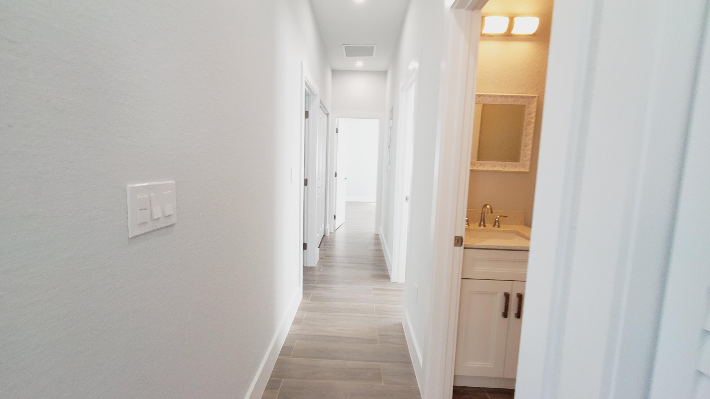 554 Gordon Circle Key Largo, FL 33037 - Photo 17 of 36 a view of a bathroom from a hallway