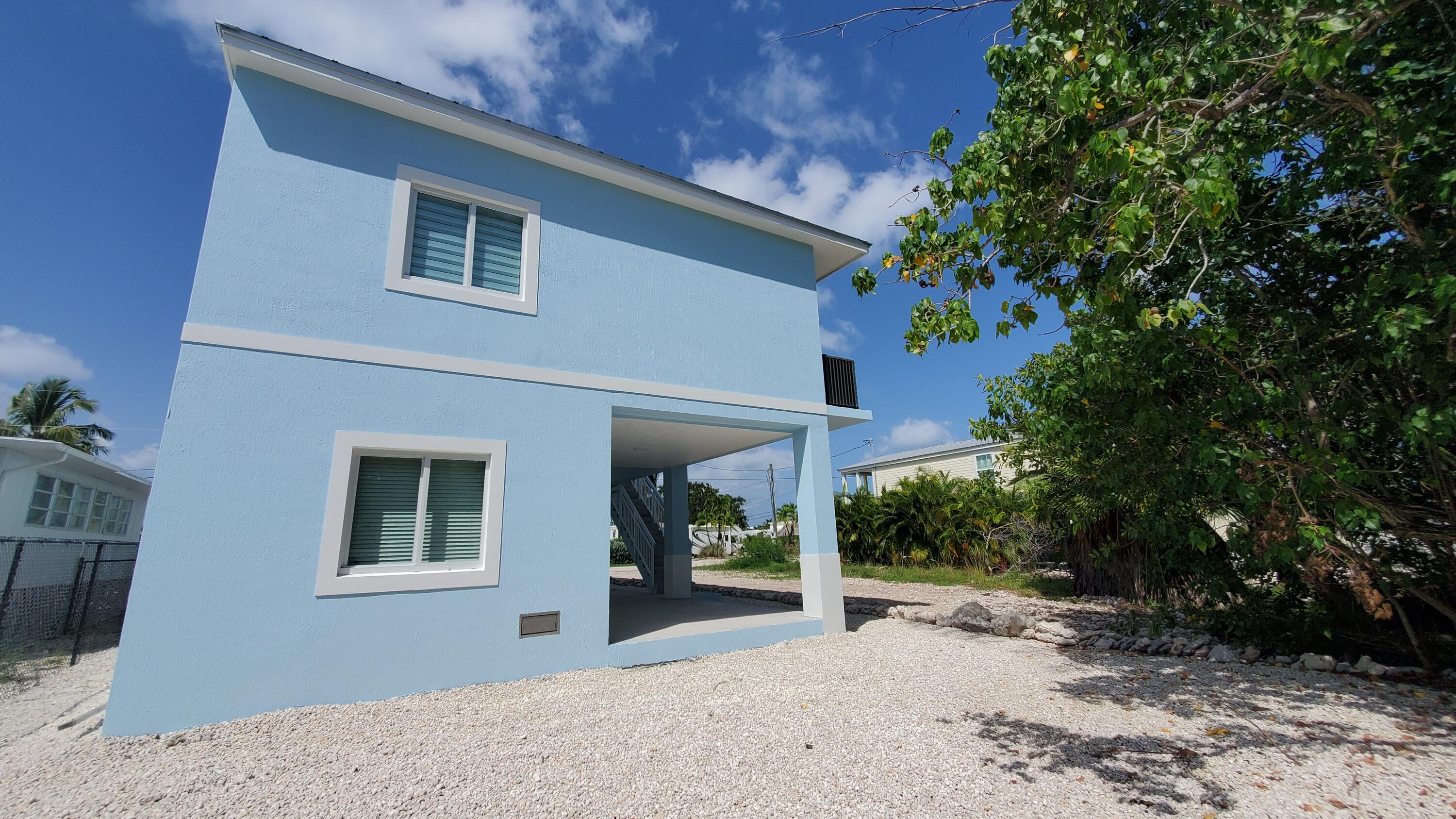 554 Gordon Circle Key Largo, FL 33037 - Photo 27 of 36 a view of a house with a backyard