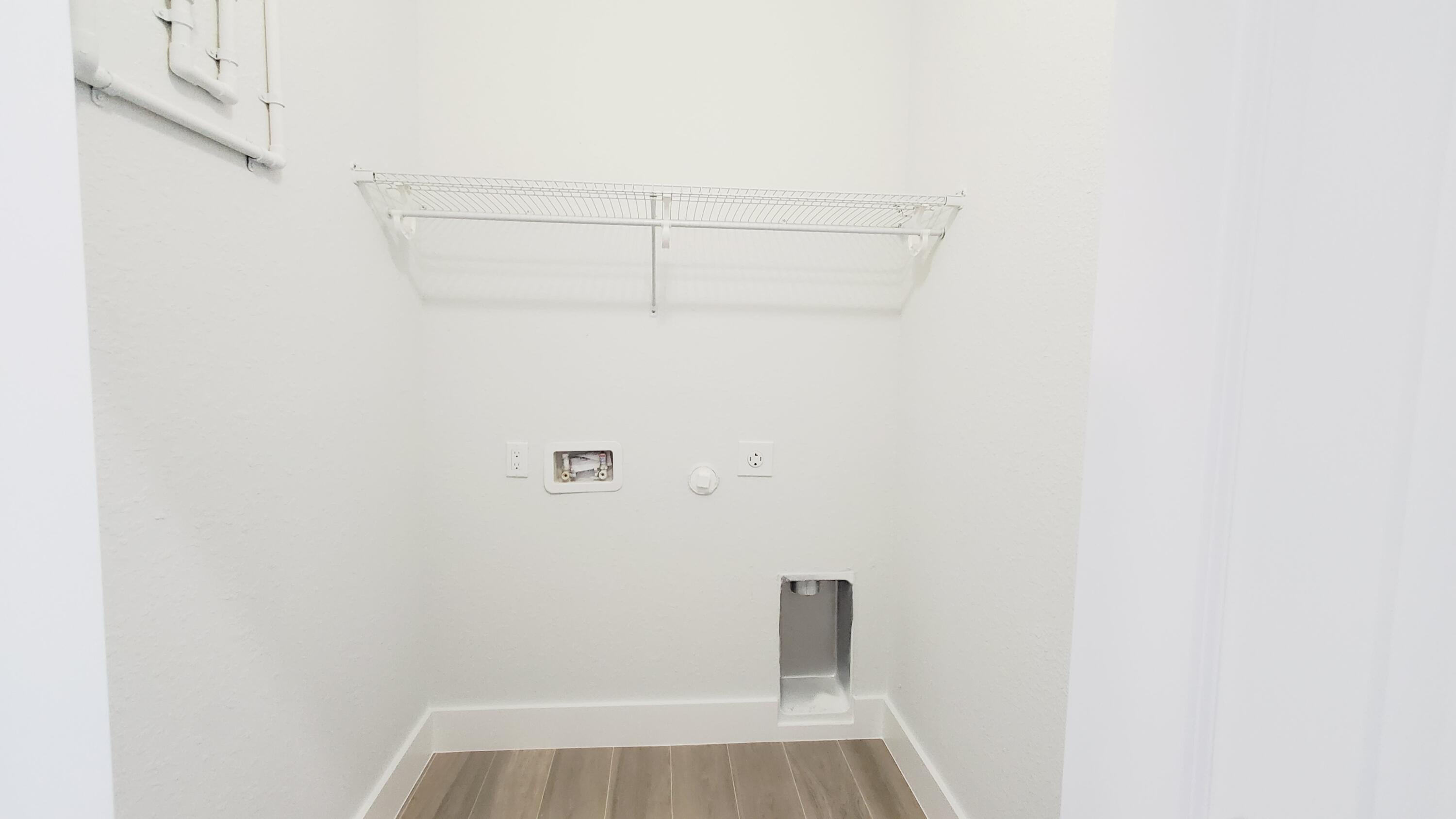 554 Gordon Circle Key Largo, FL 33037 - Photo 30 of 36 a view of a room with racks on the wall