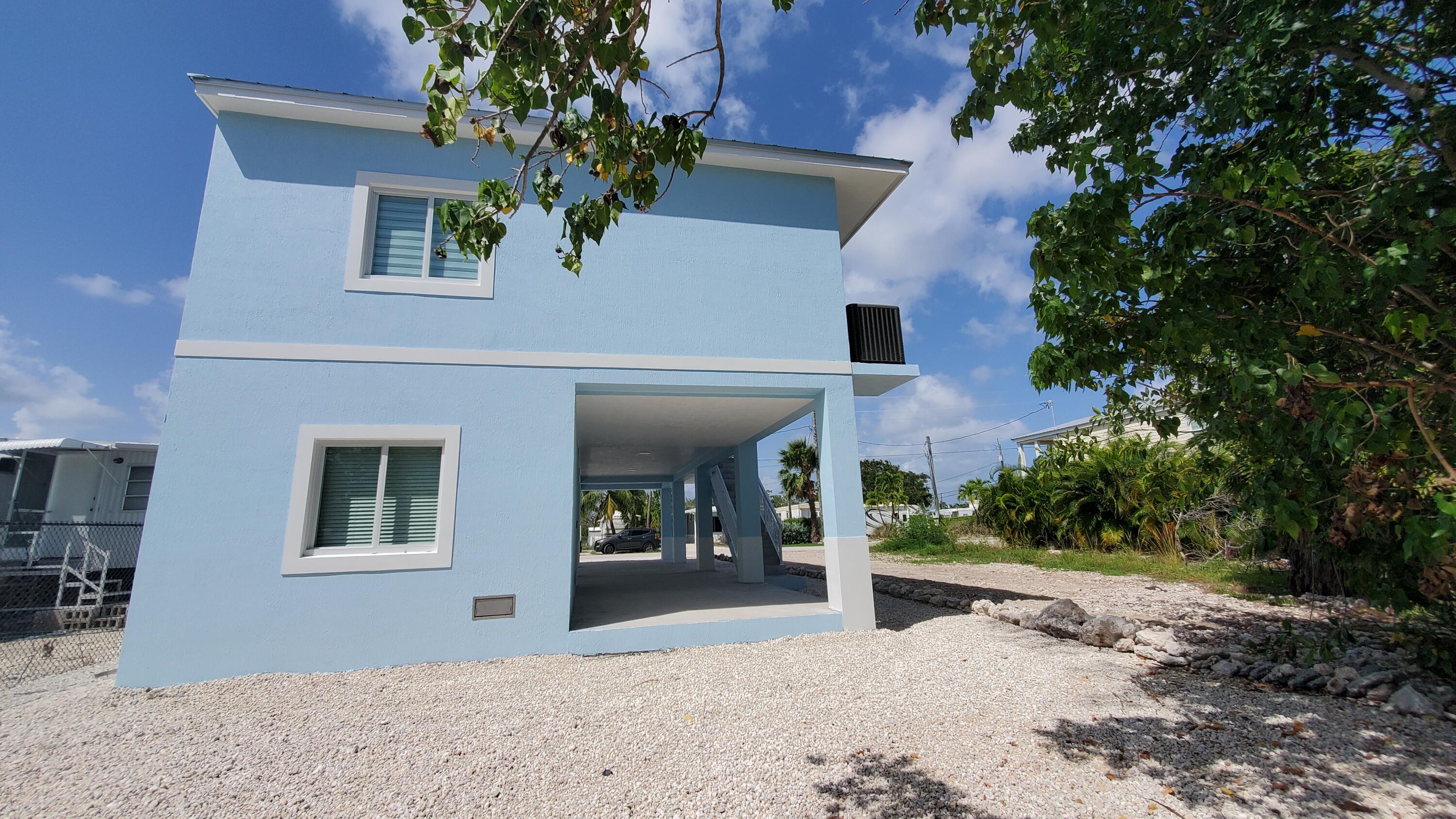 554 Gordon Circle Key Largo, FL 33037 - Photo 31 of 36 a front view of a house with garden