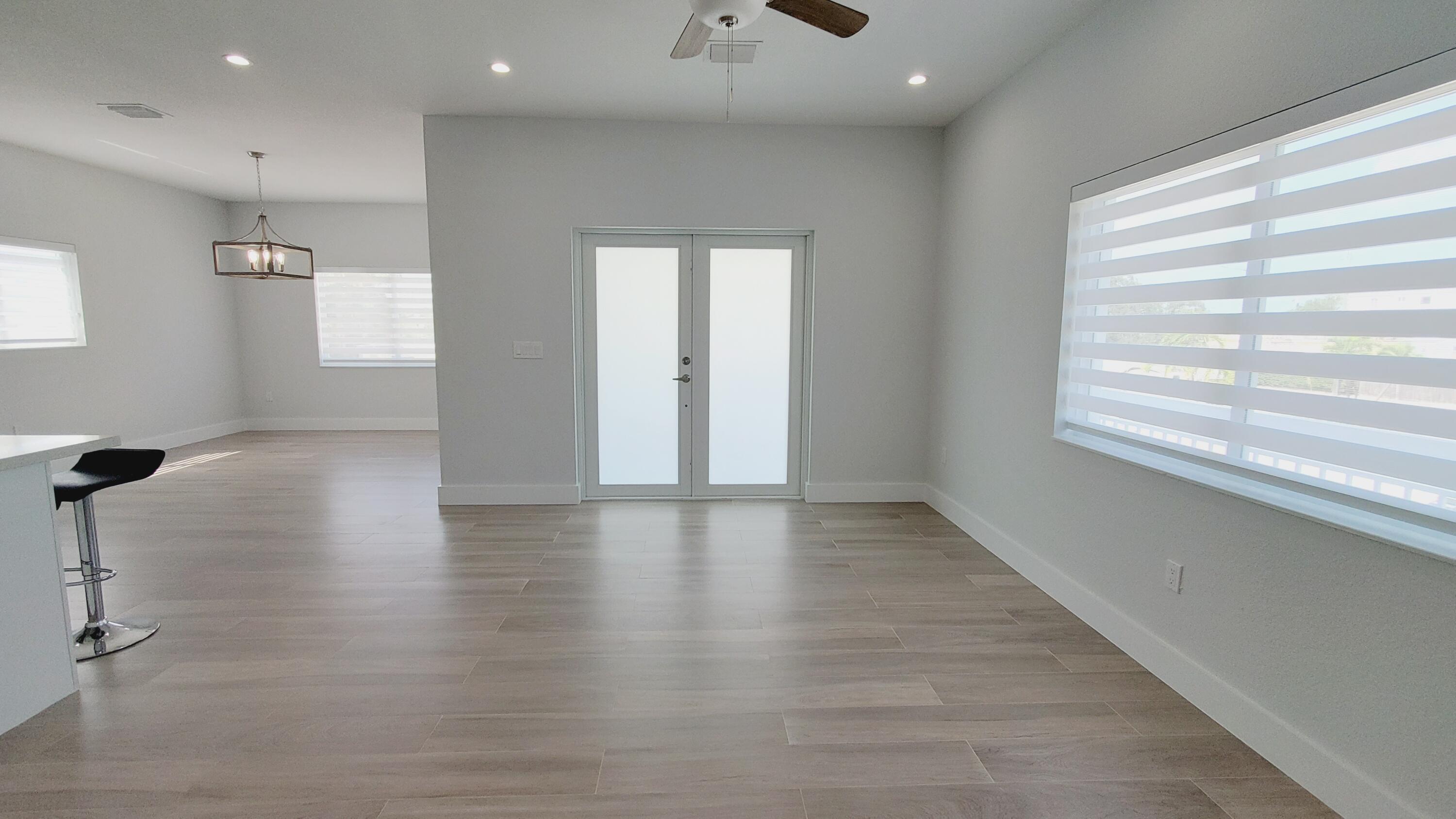 554 Gordon Circle Key Largo, FL 33037 - Photo 8 of 36 a view of empty room with wooden floor and fan