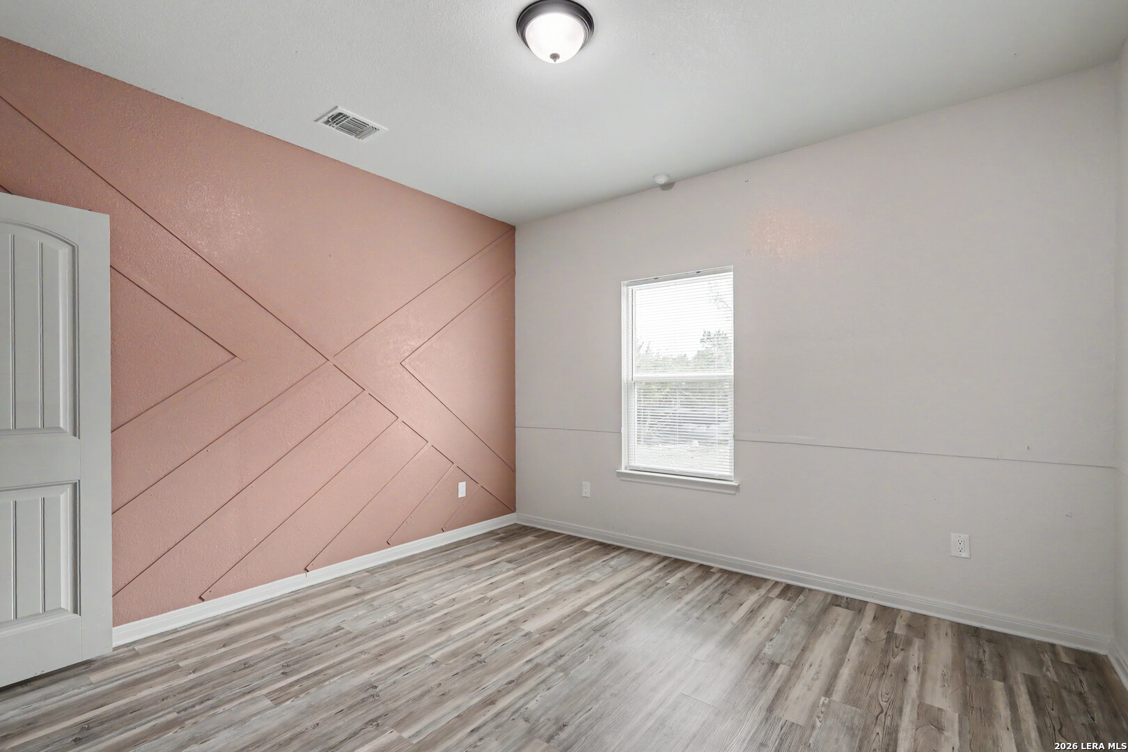 2071 Hornsby Spring Branch, TX 78070 - Photo 16 of 20 an empty room with wooden floor and windows