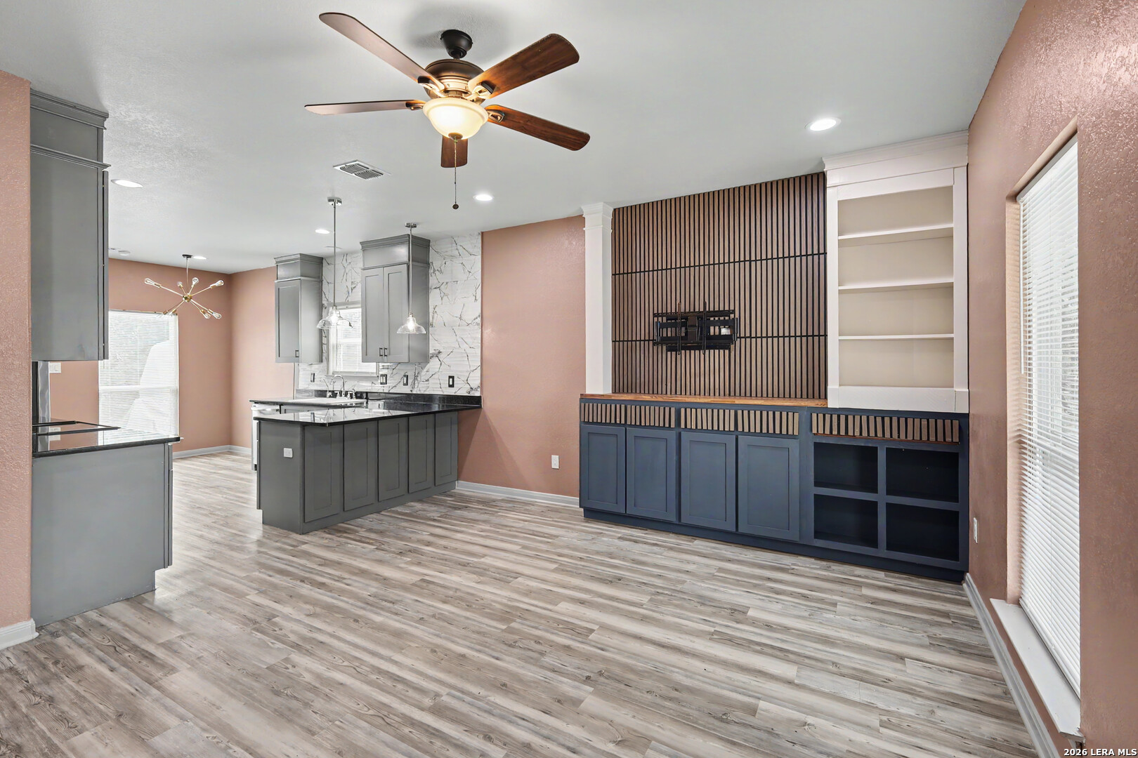 2071 Hornsby Spring Branch, TX 78070 - Photo 4 of 20 a large kitchen with stainless steel appliances a large counter top a stove and a refrigerator