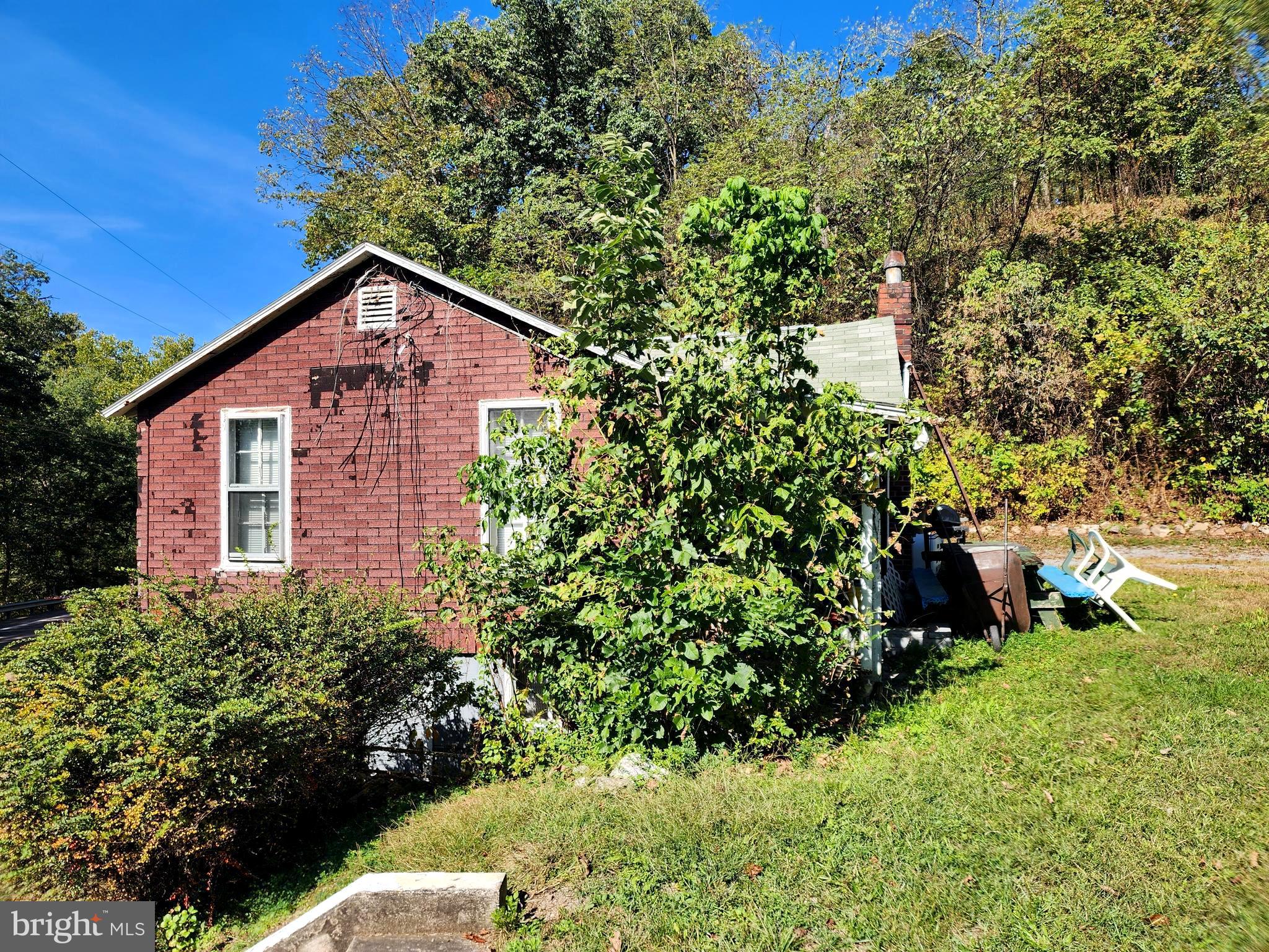 13214 Oldtown Road Southeast Cumberland, MD 21502 - Photo 12 of 15 a view of a house with a yard