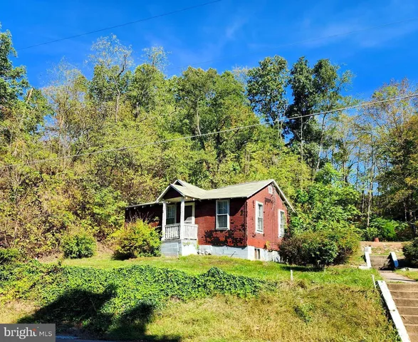 a front view of a house with yard