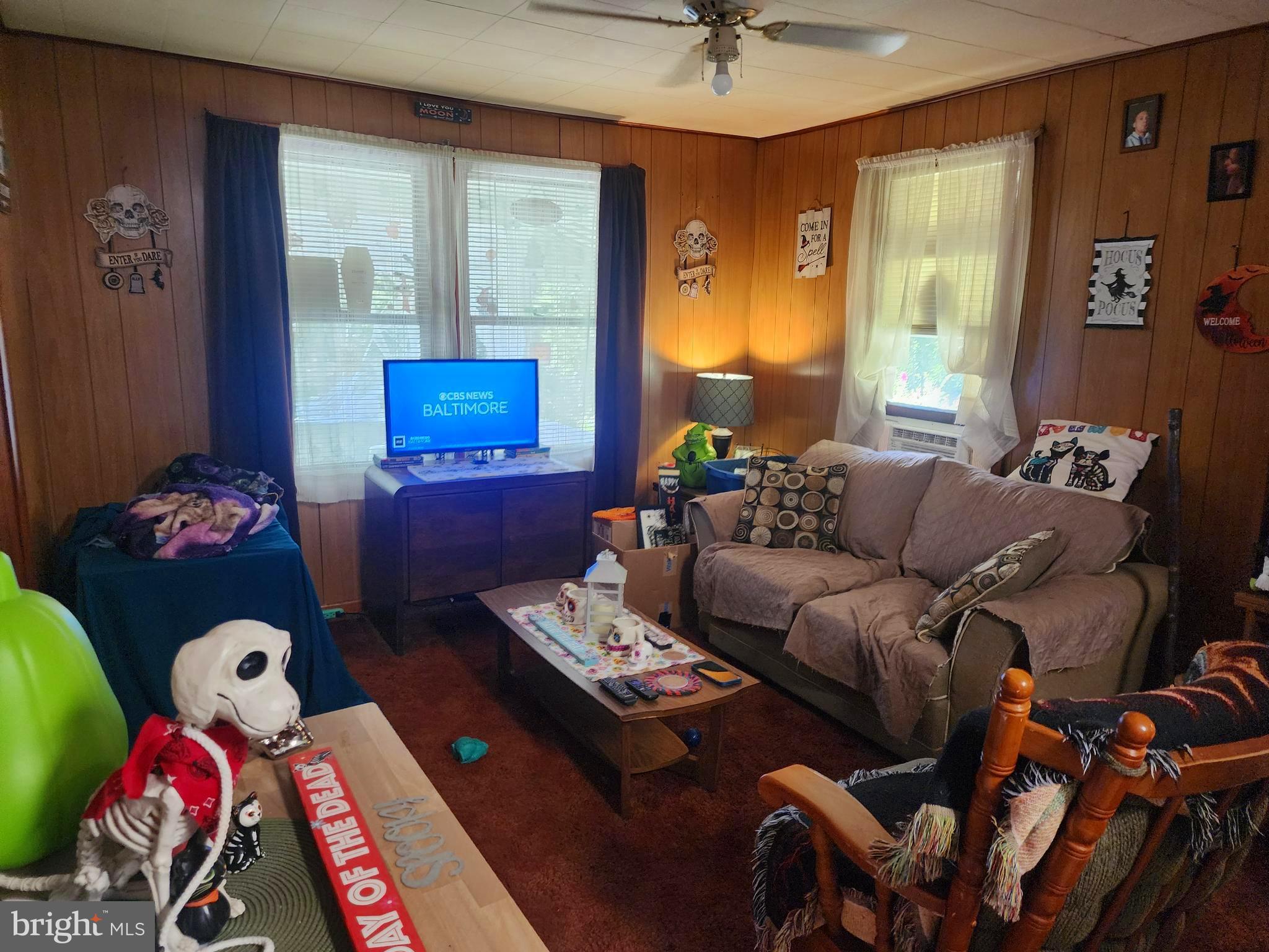 13214 Oldtown Road Southeast Cumberland, MD 21502 - Photo 5 of 15 a living room with furniture chess board and a window