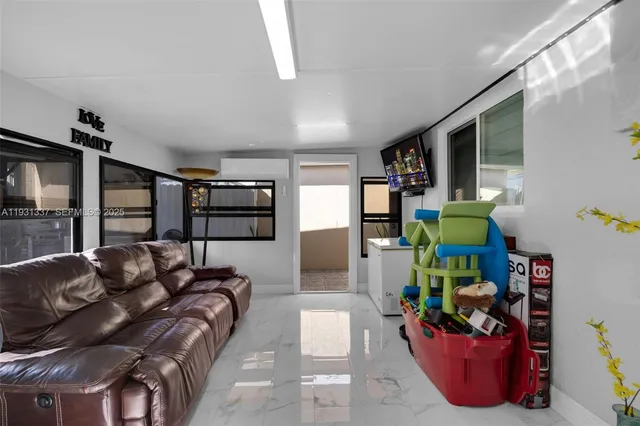 a living room with furniture and a window