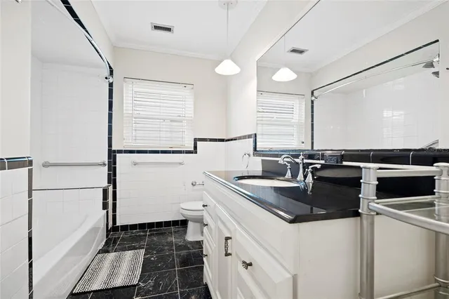 a kitchen that has a sink and a stove in it