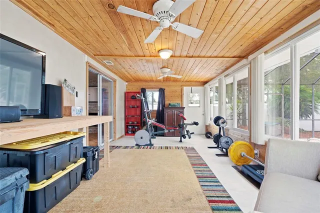 a living room filled with furniture and a chandelier